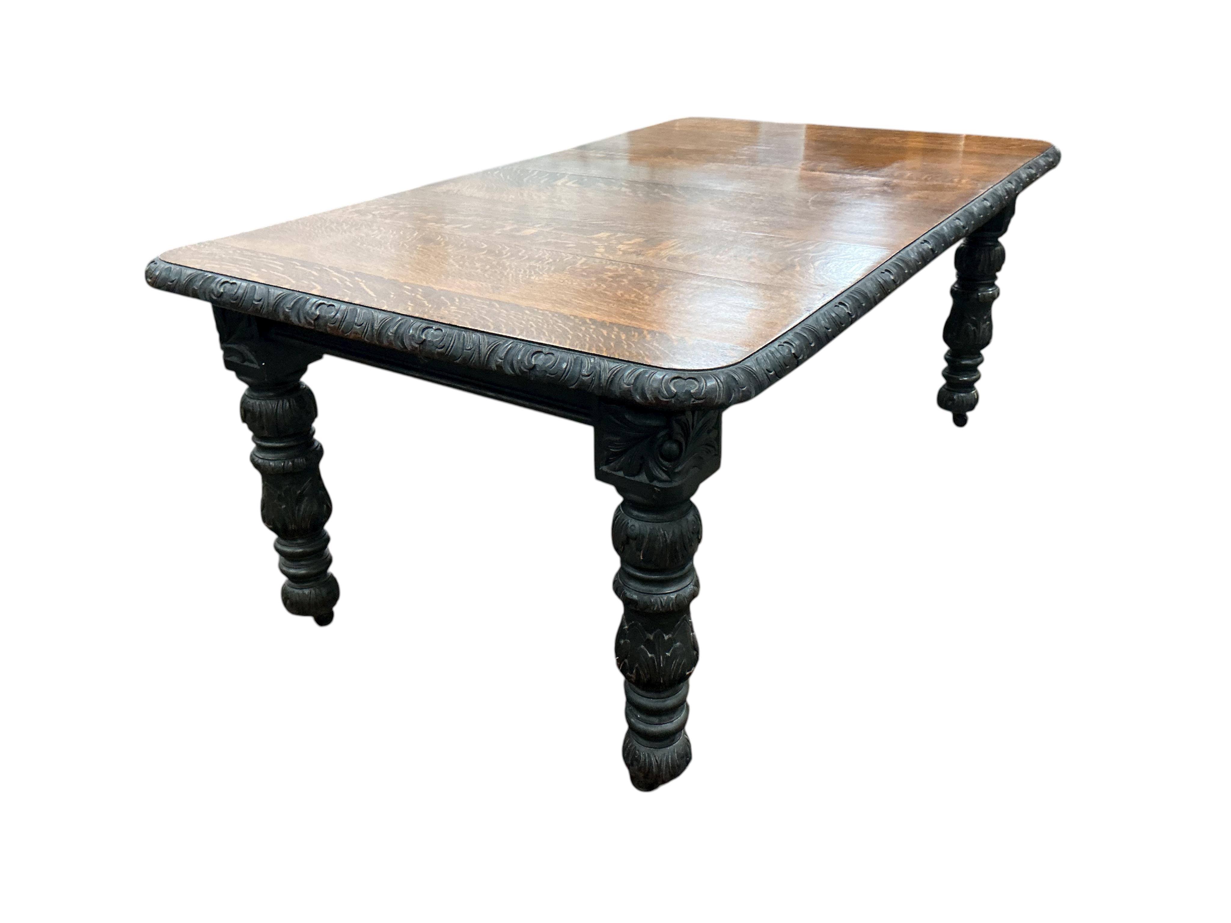 A late Victorian carved oak extending dining table, width 176cm extended, one spare leaf, depth 104cm, height 73cm